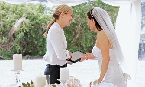 Wedding planner updates a bride and listens to any feedback provided.