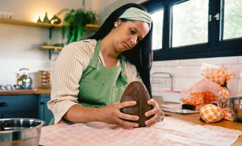 Person making easter chocolates with skills learned from class.